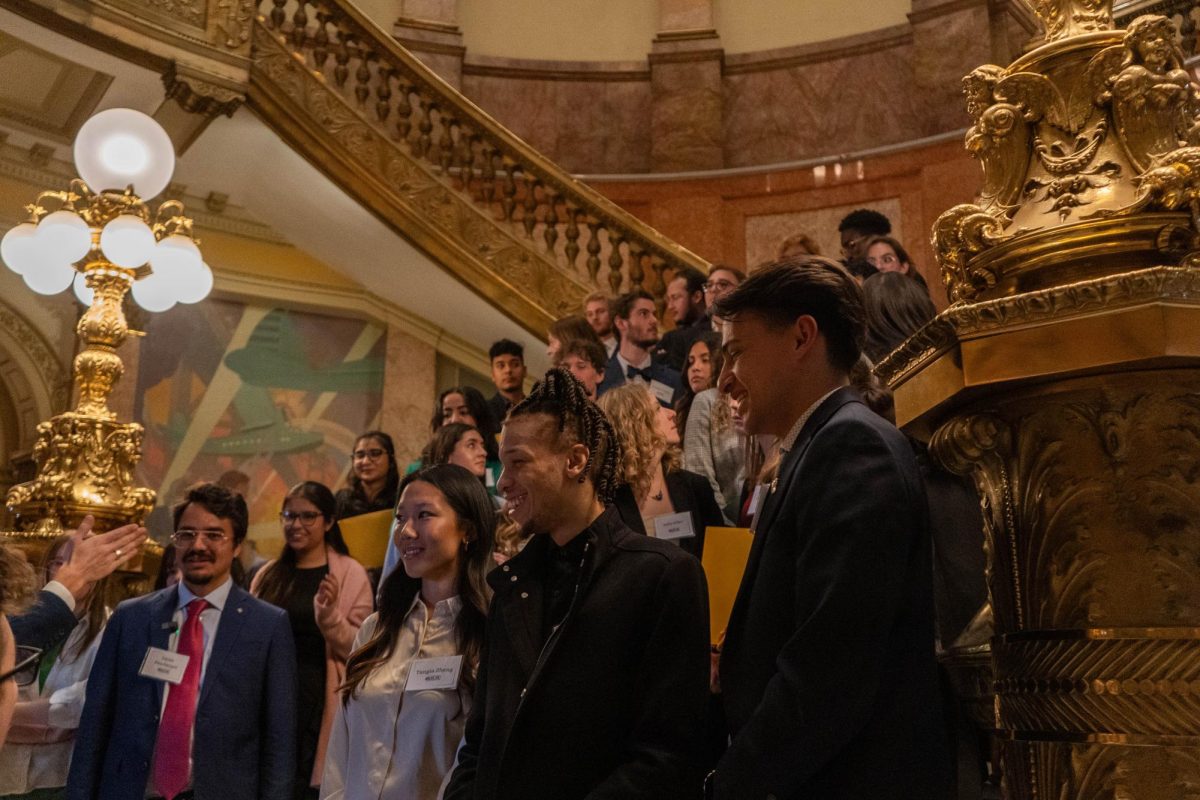 Members of the Associated Students of Colorado State University stand on the stairs in the foyer of the Colorado State Capitol building Feb. 8. The participants in the Day at the Capitol event listened to House of Representatives and Senate meetings and attended committee meetings.