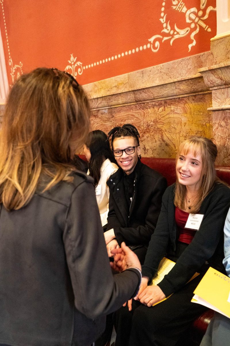Hunter Leyendecker, deputy director of graphic design for the Associated Students of Colorado State University, and Jakye Nunley, deputy director of health for ASCSU, speak with Sen. Lisa Cutter Feb. 8. Senators like Cutter engaged with students at the Day at the Capitol event. 