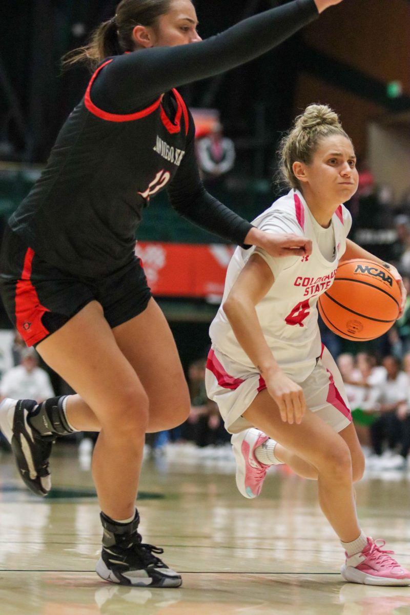 Colorado State University No.4 McKenna Hofschild works her way around San Diego State University's defense to score for the Rams at the women's basketball game against San Diego State University. Feb. 3.