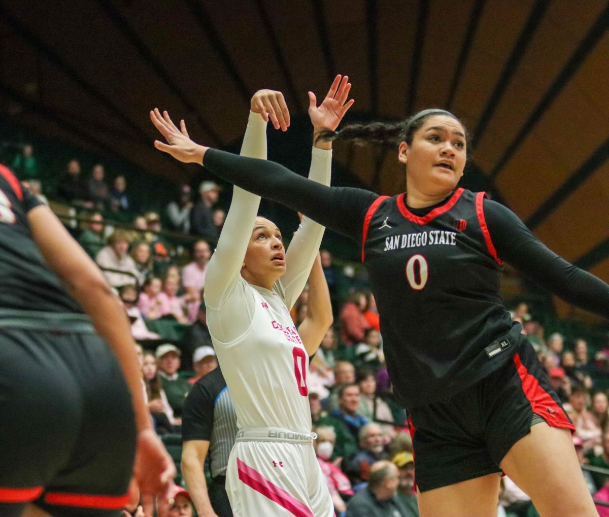 Colorado State University No.0 Kendyll Kinzer shoots the ball over San Diego State University's defense at the women's basketball game against San Diego State University. Feb. 3.