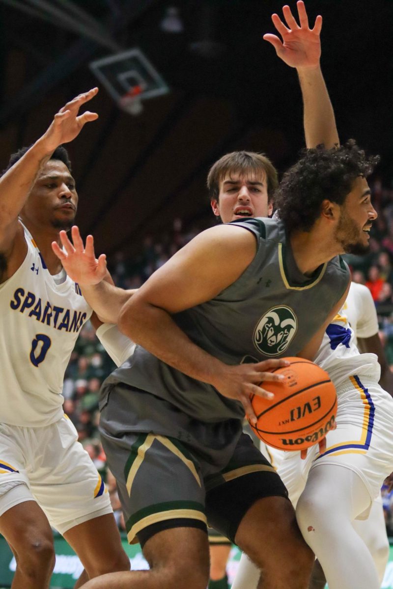 Colorado State University No. 21 Rashaan Mbemba works towards the hoop against San Jose State University's defense at the basketball game against San Jose State University. CSU won 66-47. Feb. 9.