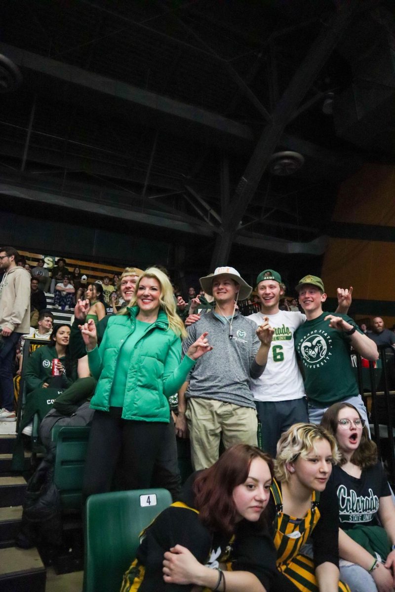 Colorado State University president Amy Parsons poses with a group of students at the basketball game against San Jose State University. CSU won 66-47. Feb. 9.