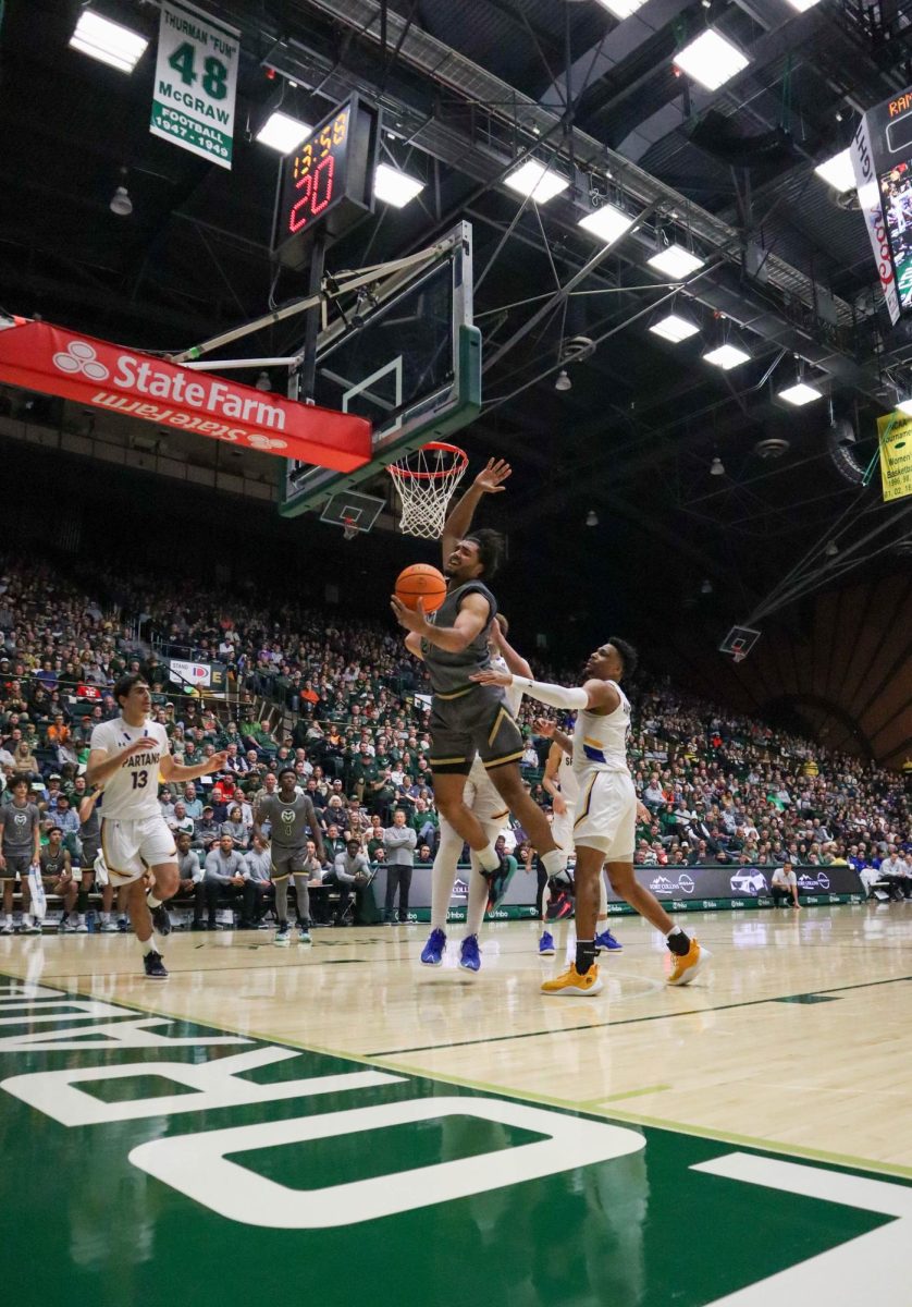 Colorado State University No. 21 Rashaan Mbemba jumps for the ball at the basketball game against San Jose State University. CSU won 66-47. Feb. 9.