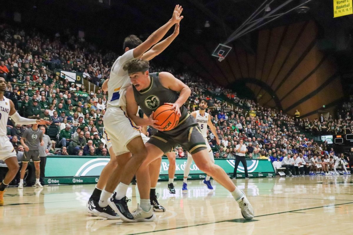 Colorado State University No. 20 Joe Palmer pushes against San Jose State University's defense at the basketball game against San Jose State University. CSU won 66-47. Feb. 9.