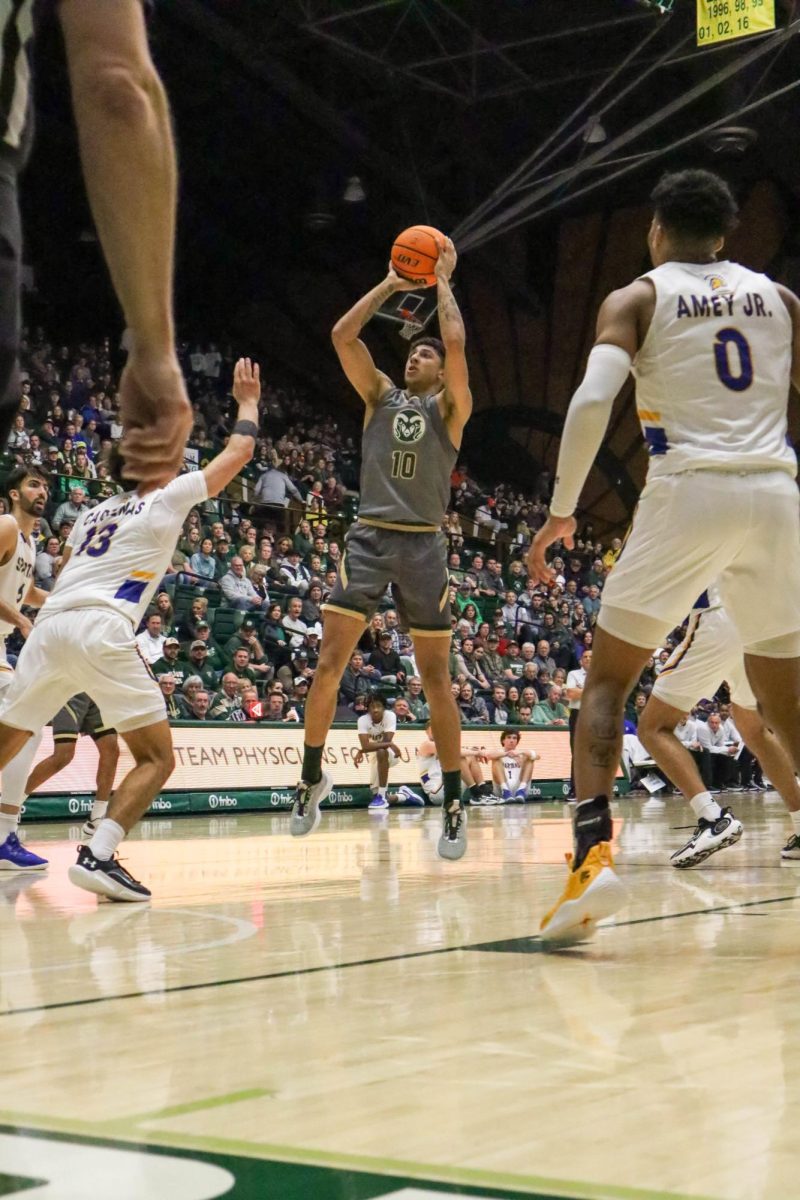 Colorado State University No. 10 Nique Clifford jumps and shoots the ball at the basketball game against San Jose State University. CSU won 66-47. Feb. 9.