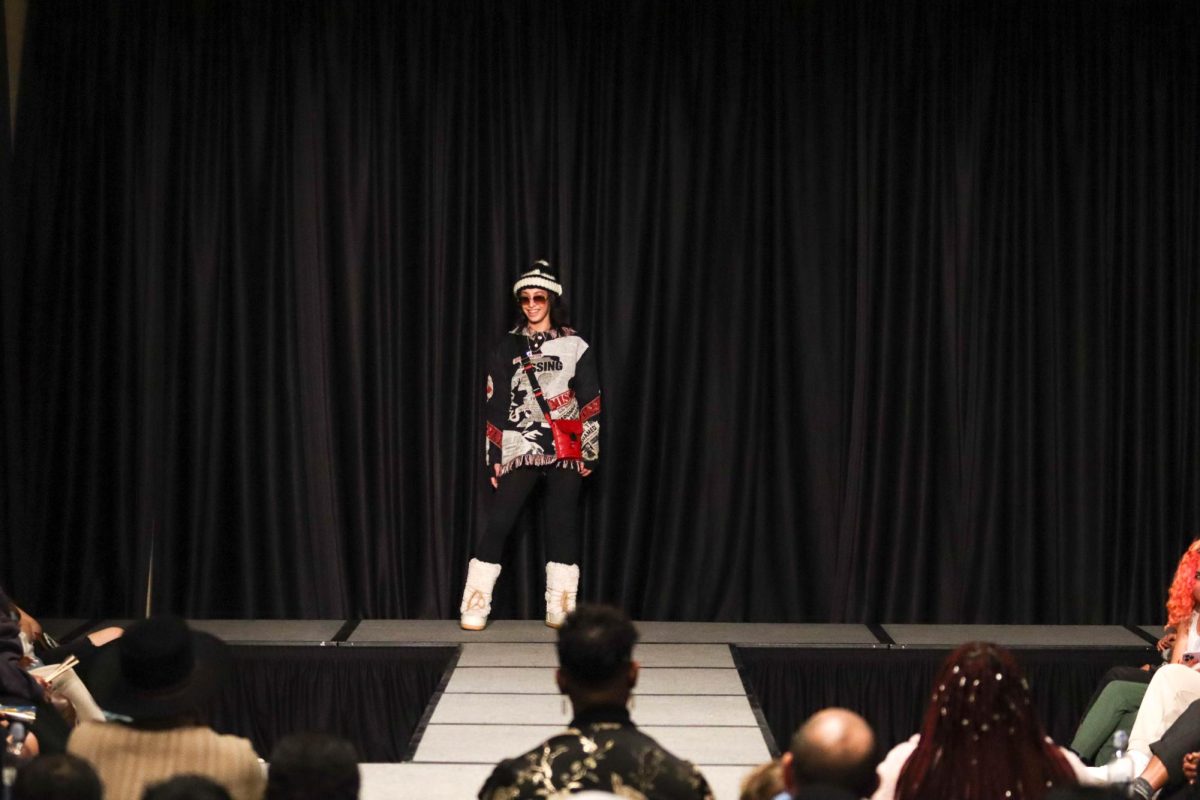 A Colorado State University student struts down the runway showing off the outfit her stylist put together at the Hair and Fashion Show hosted by United Men of Color and United Women of Color. Feb 22.