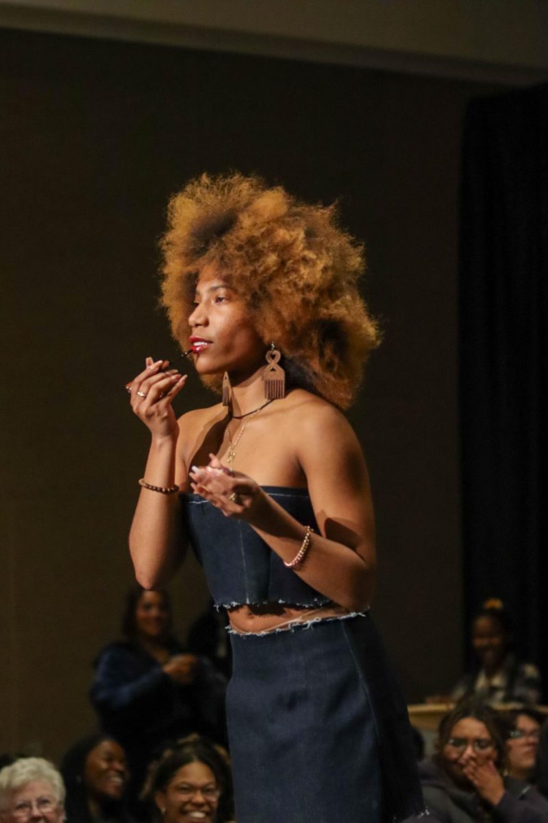 Colorado State University art student Nura Abdullaah models clothing designed by students at the Hair and Fashion Show put on by United Women of Color and United Men of Color. Feb 22