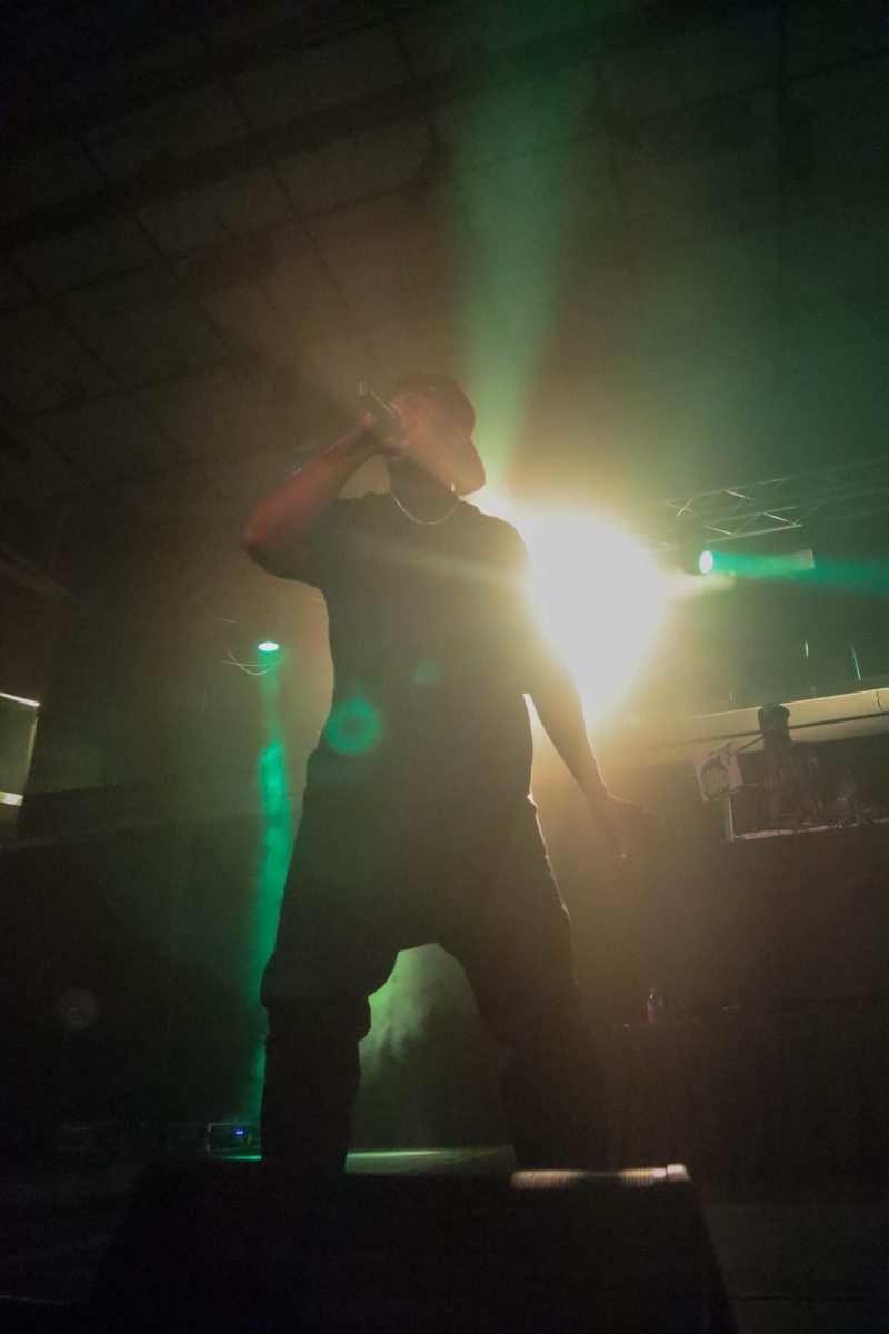 One of four Coast Contra members jams alongside DJ Damage and the other member of the Hip-Hop group. Feb 22.