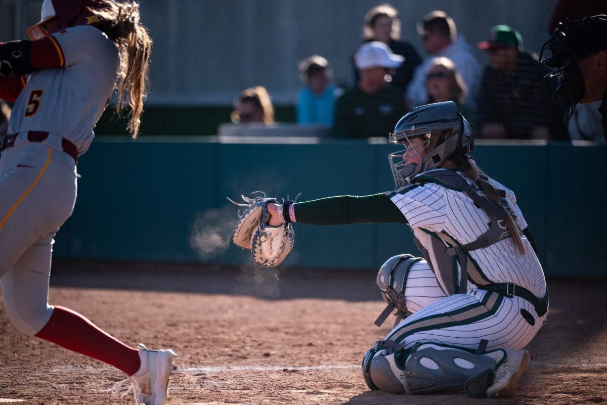 Freshman Abby Edwards (34) catches a missed ball at a second game against Iowa State.