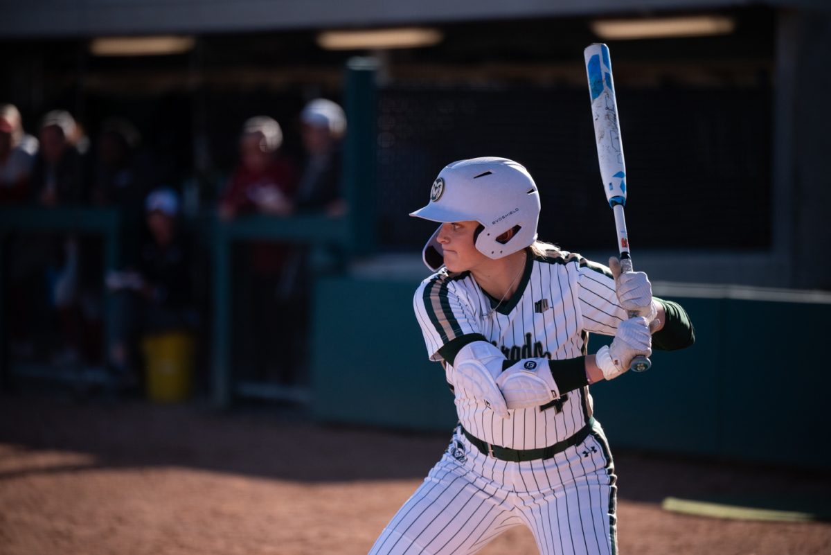 Senior Molly Gates (4) gets ready to swing at a game against Iowa State.