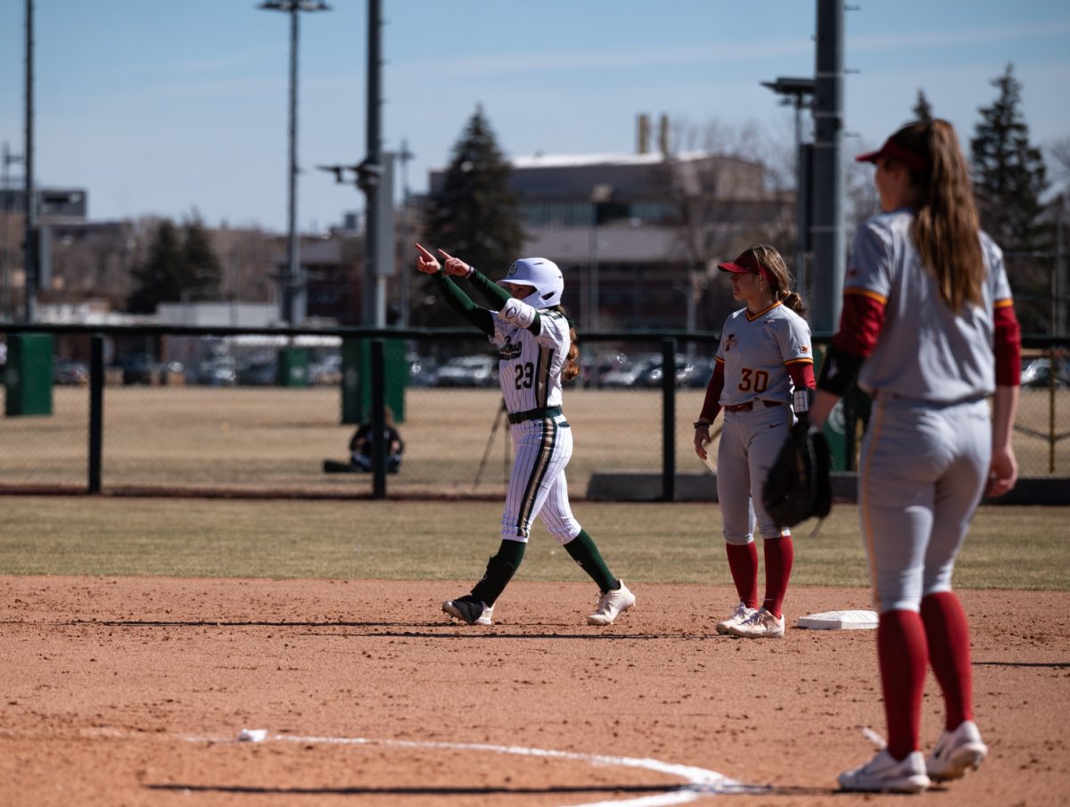 Graduate student Peyton Allen (23) celebrates after making it to second base during a game against Iowa State.