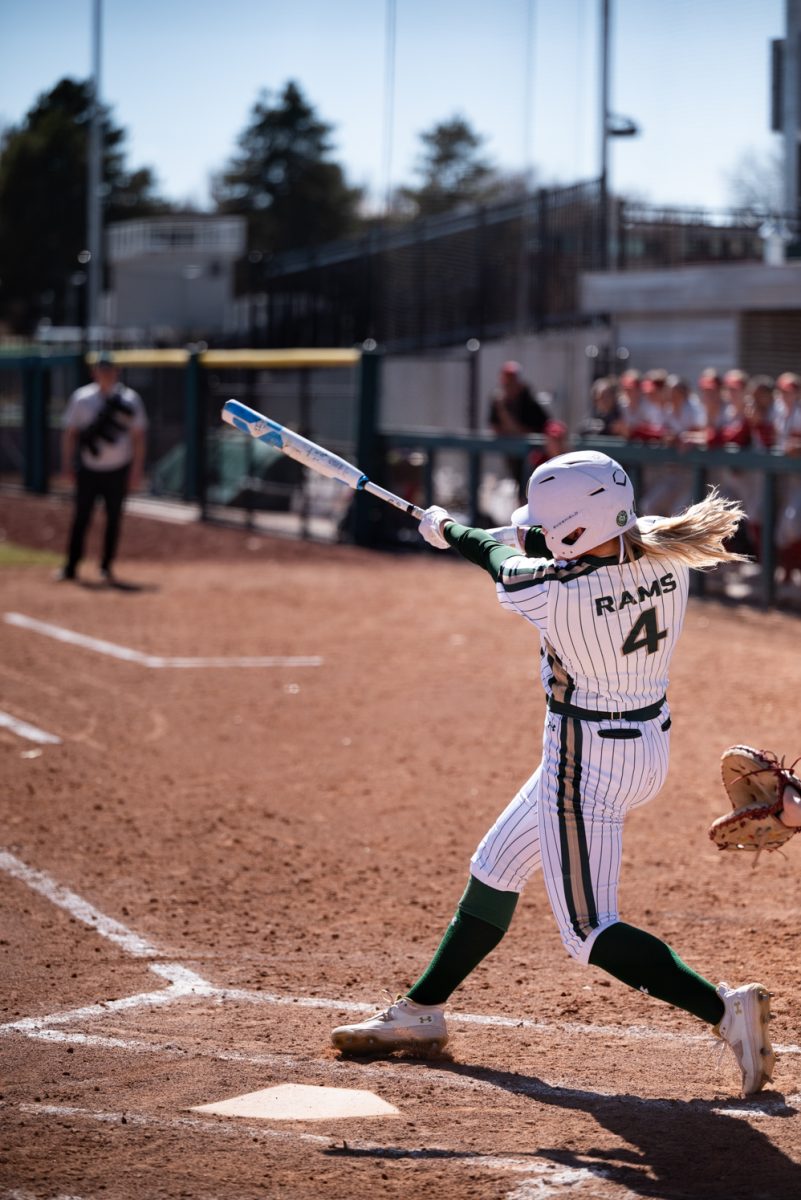 Senior Molly Gates (4) hits a pitch from Iowa State.