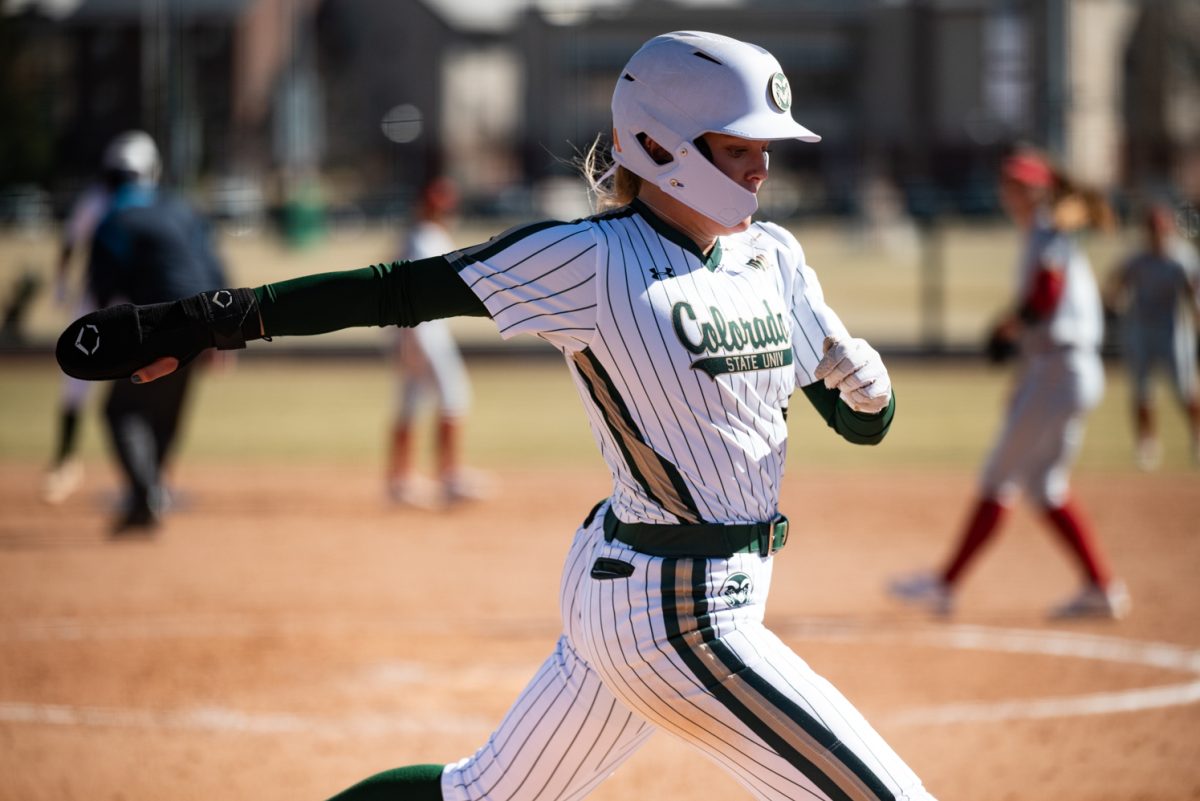 Senior Molly Gates (4) runs to home base during a game against Iowa State.