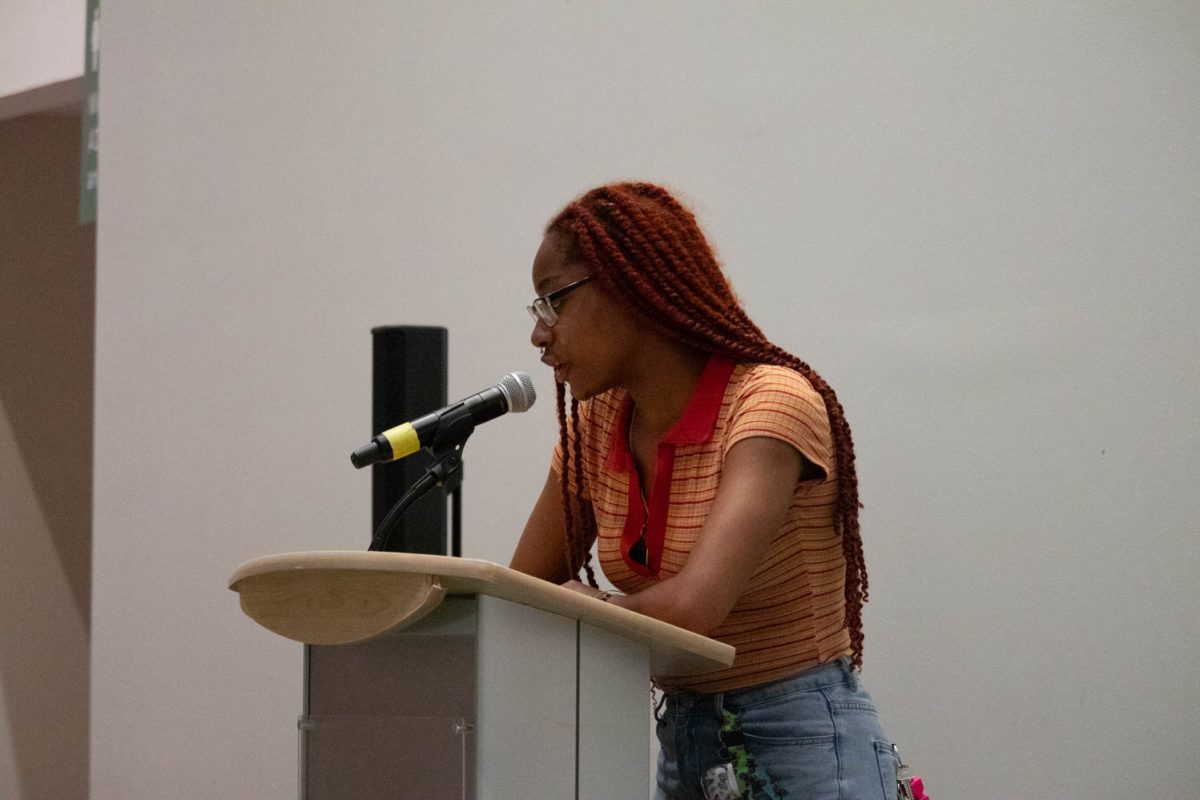Kylynn White reads her poem, "Asha and Her Hope" during the Black History Month Closing Open Mic Night on February 29, 2024.
