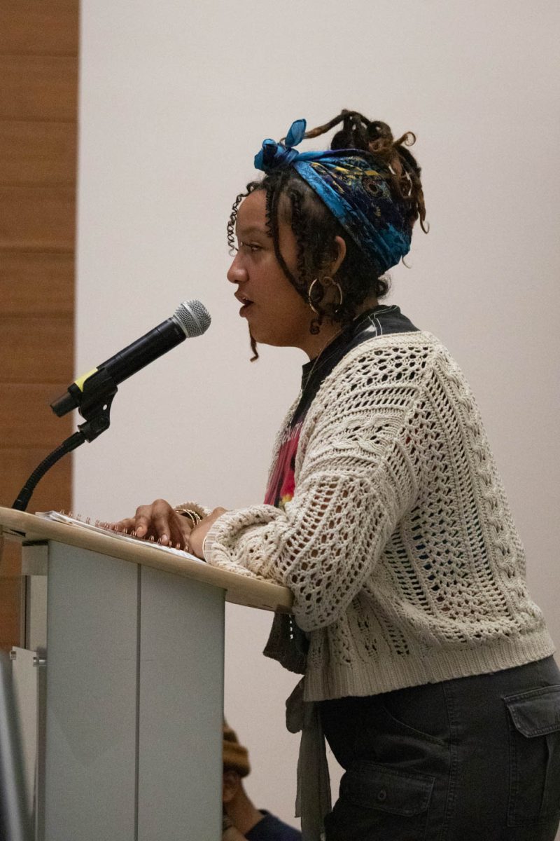 Olive White Eagle-Dodson, the MC of the Black History Month Closing Open Mic Night reads "Like a Tree" on February 29, 2024.