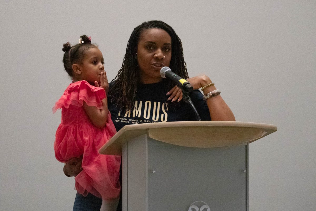 Destiny Hardney and her daughter Iya'Jade introduce the next set of performers during the Black History Month Closing Open Mic Night on February 29, 2024.