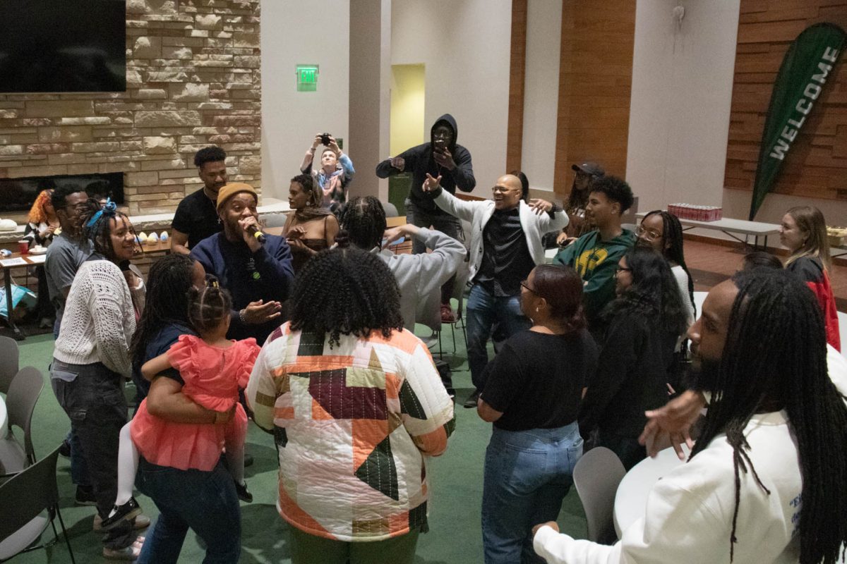 The crowd participates in the final performance during the Black History Month Closing Open Mic Night on February 29, 2024.
