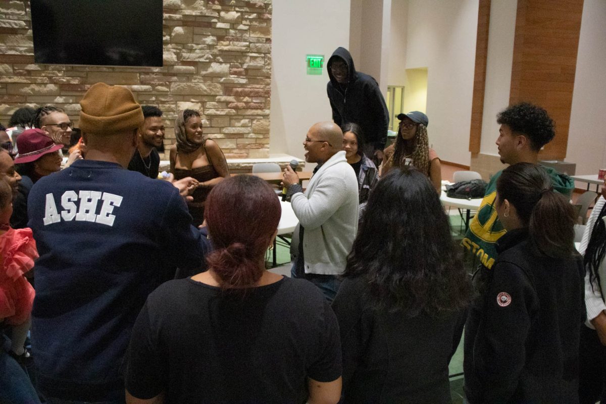 The crowd participates in the final performance during the Black History Month Closing Open Mic Night on February 29, 2024.