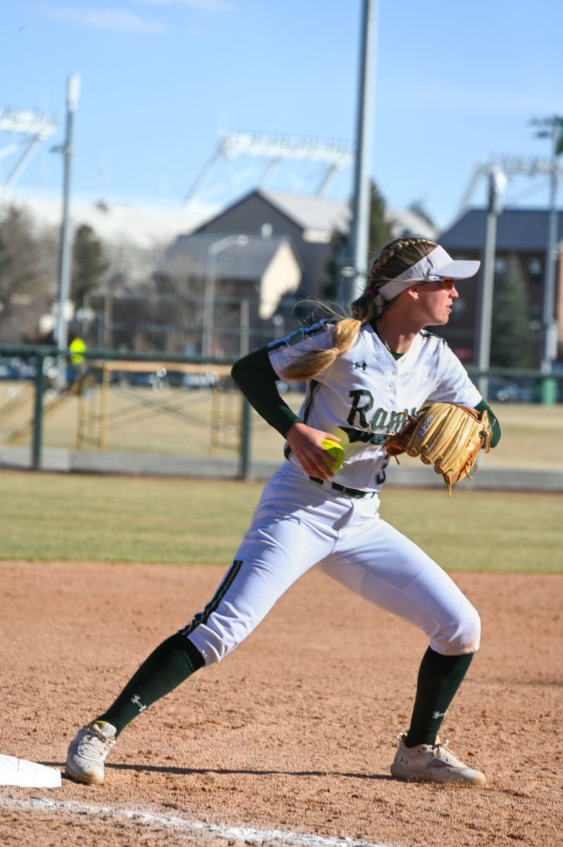 Morgan Crosby goes to make a throw from third to first during Colorado State University's softball game against Manhattan College March 2, 2024. CSU won 13-5.
