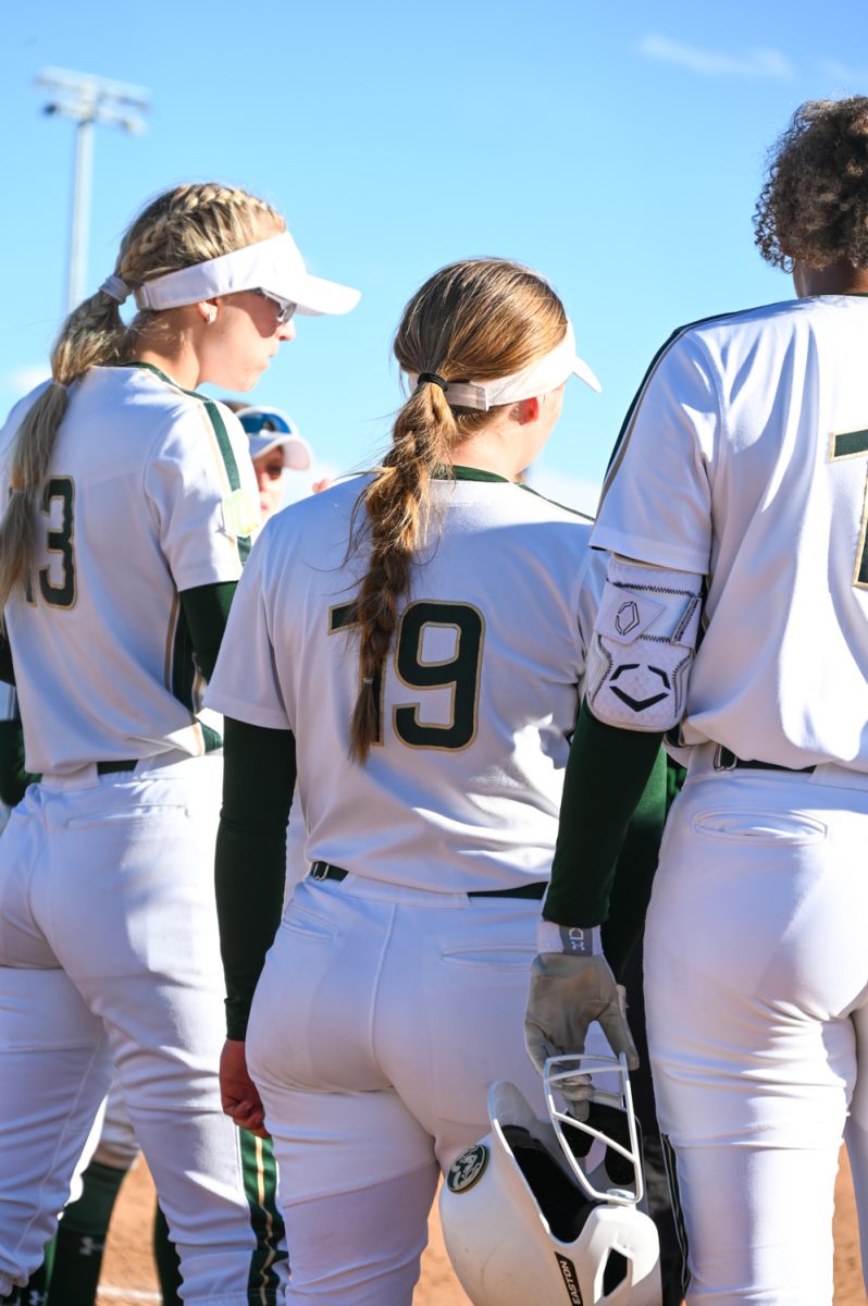 #19 Nadia DeZeeuw stands with her team after an inning during the CSU vs. Manhattan softball game on March 2, 2024. (CSU won 13-5)