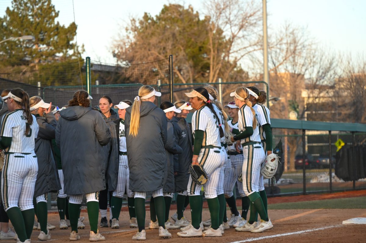 The CSU softball team huddles up after an inning during the CSU vs. Drake softball game on March 9, 2024. (CSU won 10-0)