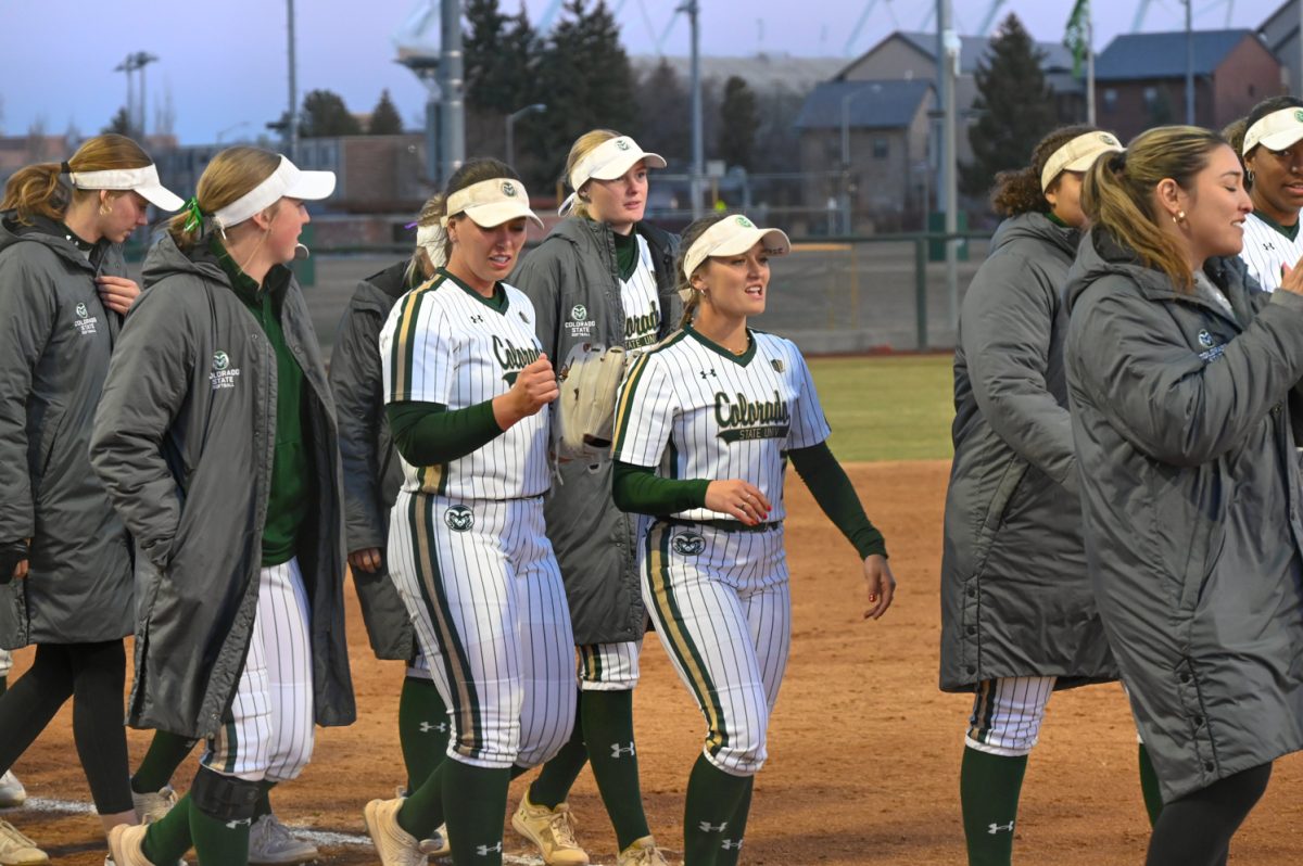 The CSU softball team lines up to high five the Drake softball team after the CSU vs. Drake softball game on March 9, 2024. (CSU won 10-0)