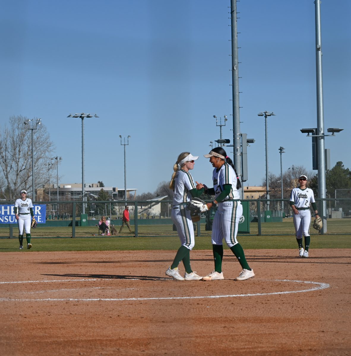 Two+CSU+players+give+each+other+a+handshake+after+a+well-made+play+during+the+CSU+vs.+University+of+Maine+softball+game+on+March+9.+%28CSU+won+6-2%29