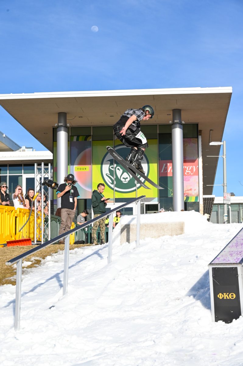 Sawyer Suplizio sends a backward trick on the rail during the Colorado State University RailJam Revival on the Lory Student Center West Lawn March 21.