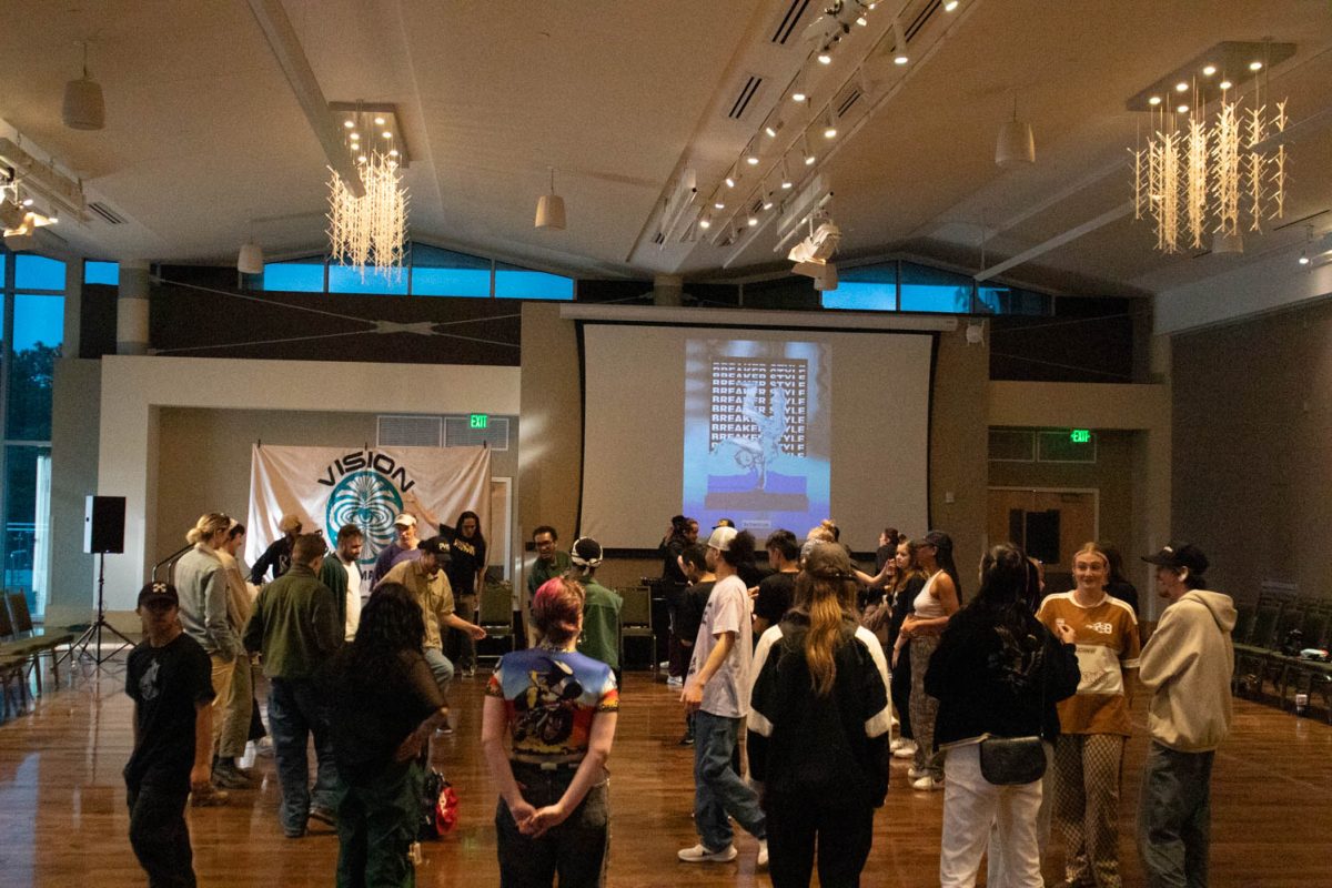 Participants and attendees mingle during a break between the action during Vision:Provoke Imagination March 30 at Colorado State University.