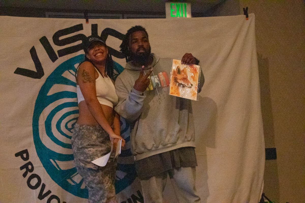 The members of "Candy Yams" pose after recieving their reward for taking second place in a 2v2 dance battle bracket during Vision:Provoke Imagination March 30.