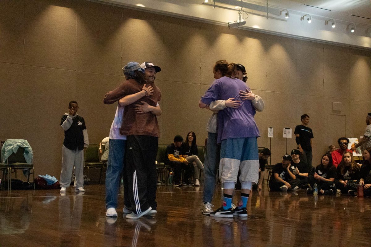 Participants hug following their 2v2 dance battle during during Vision: Provoke Imagination March 30 at Colorado State University.