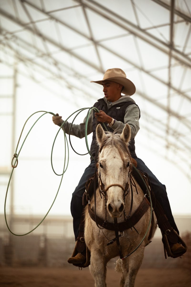 Diego Rolon rides back from practicing roping at a Colorado State University rodeo team practice in Nuun, Colorado.
