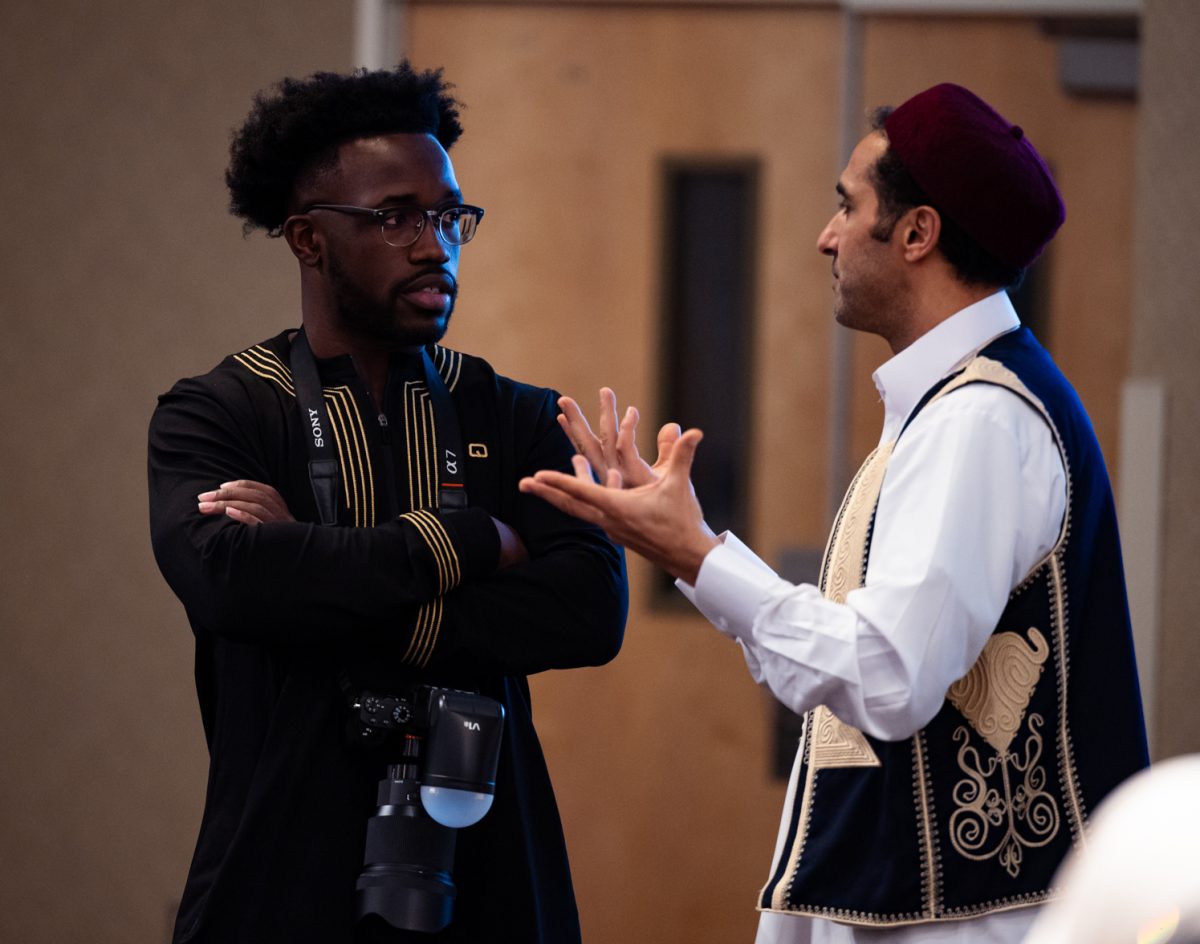 Joseph Kamara and Ramadan Abdunabi, Colorado State University alumni, take a moment to catch up at the Ramadan Iftar Dinner Event in the Lory Student Center Ballroom.