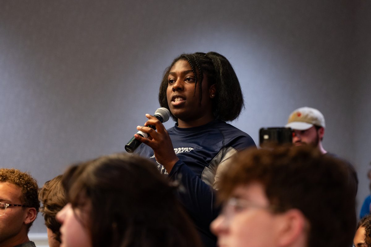Jasmine Retland asks a question during the audience questions segment of the ASCSU Presidential and Vice Presidential Debates.