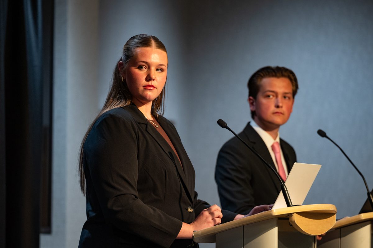 CTV hosts Bailey Borkowski and Tate Paisley listen to the candidates' opening remarks at the ASCSU Speaker of the Senate Debate.