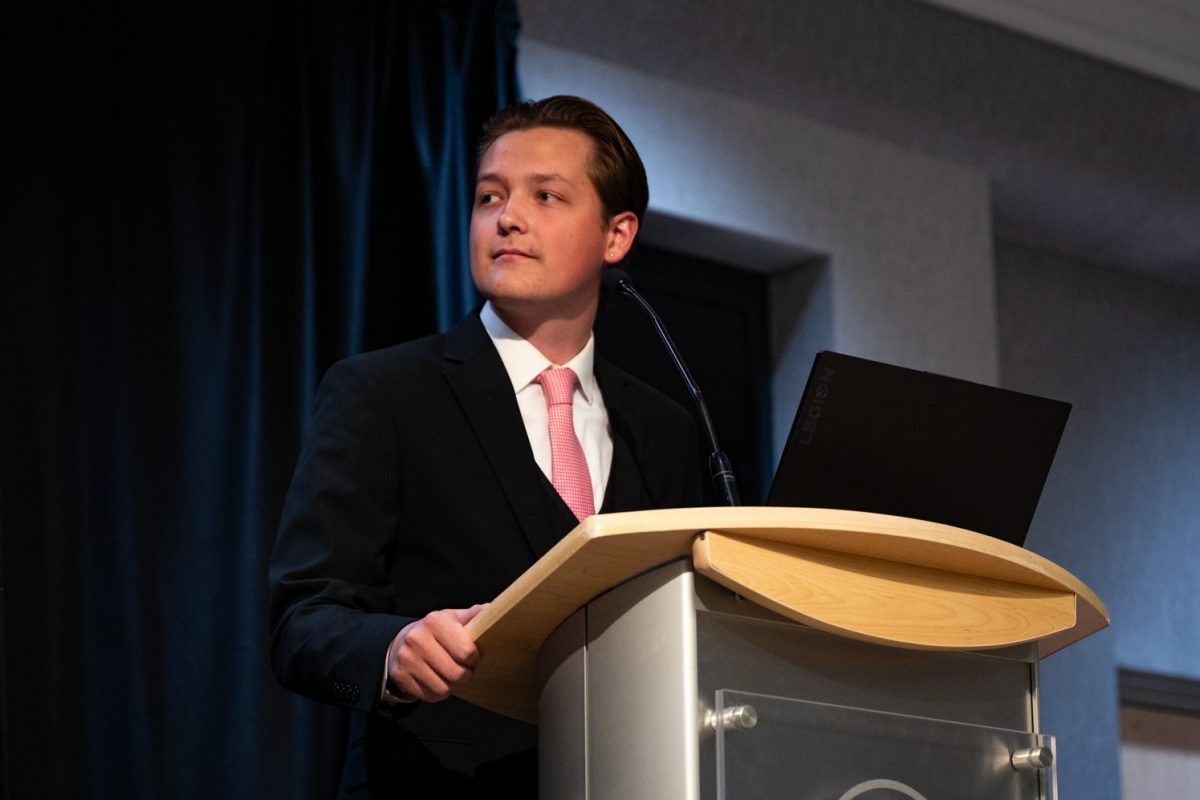 CTV host Tate Paisley listens to the candidates' opening remarks at the ASCSU Speaker of the Senate Debate.