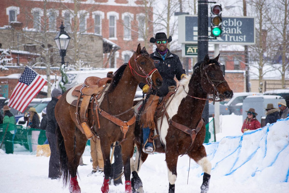 Skijoring trainer and rider warms up horses before the start of the Leadville, Colorado, skijoring event March 3.