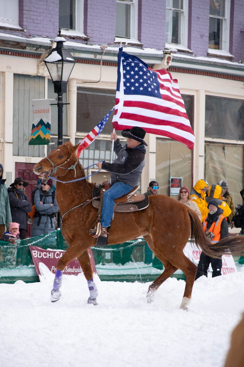 Tim McCarthy wrangles his horse while preparing for the national anthem ride at the Leadville, Colorado, skijoring event March 3.