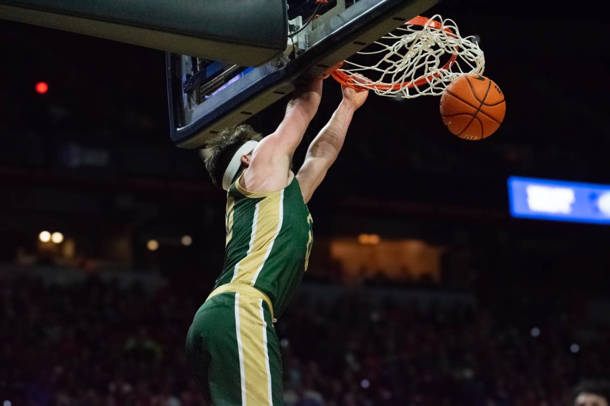 Colorado State University guard Joe Palmer dunks during the CSU game against The University of New Mexico in the Mountain West mens basketball championship semi-final game March 15. CSU lost 74-61.