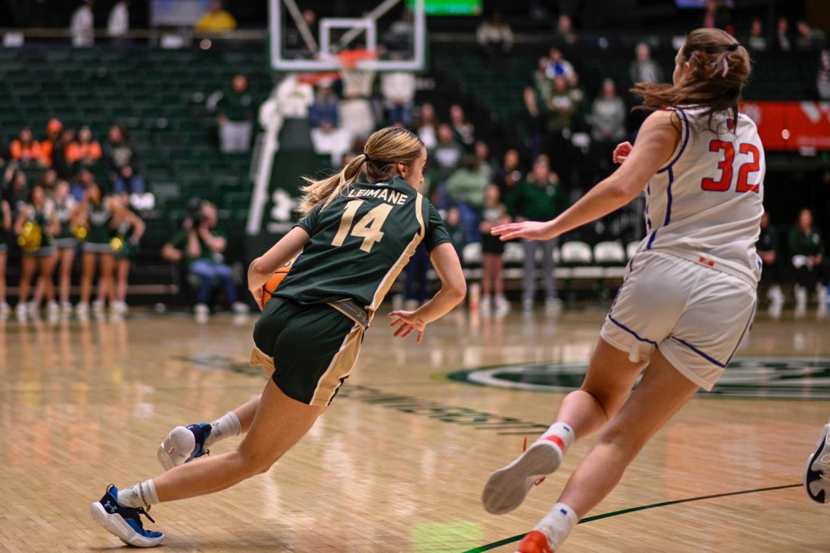 Guard Marta Leimane runs the ball past an opponent at the Colorado State University womens basketball Senior Night game at Moby Arena March 5.