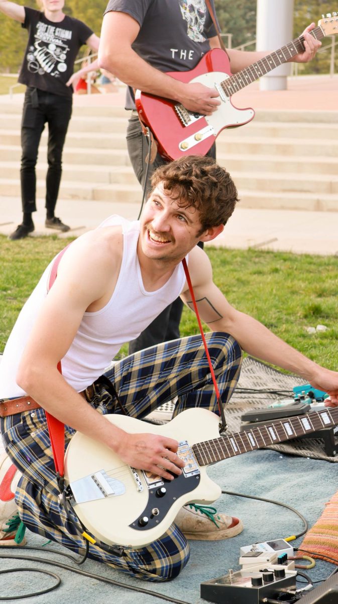 Ian Ehrhart of Jesus Christ Taxi Driver gives a playful performance engaging the audience at Fools Fest at Colorado State University April 4. 