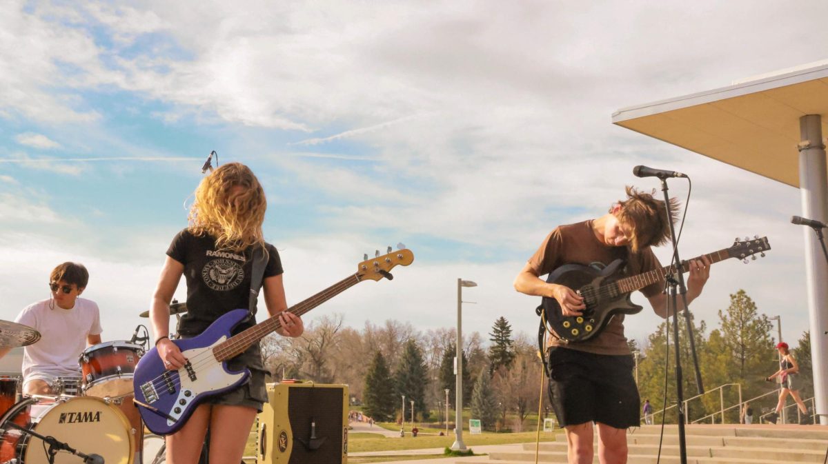 From left to right, Aedyn Simon, Riley Hilbert and Jenison Brown of The Skratchmen jam at Fools Fest at Colorado State University April 4.