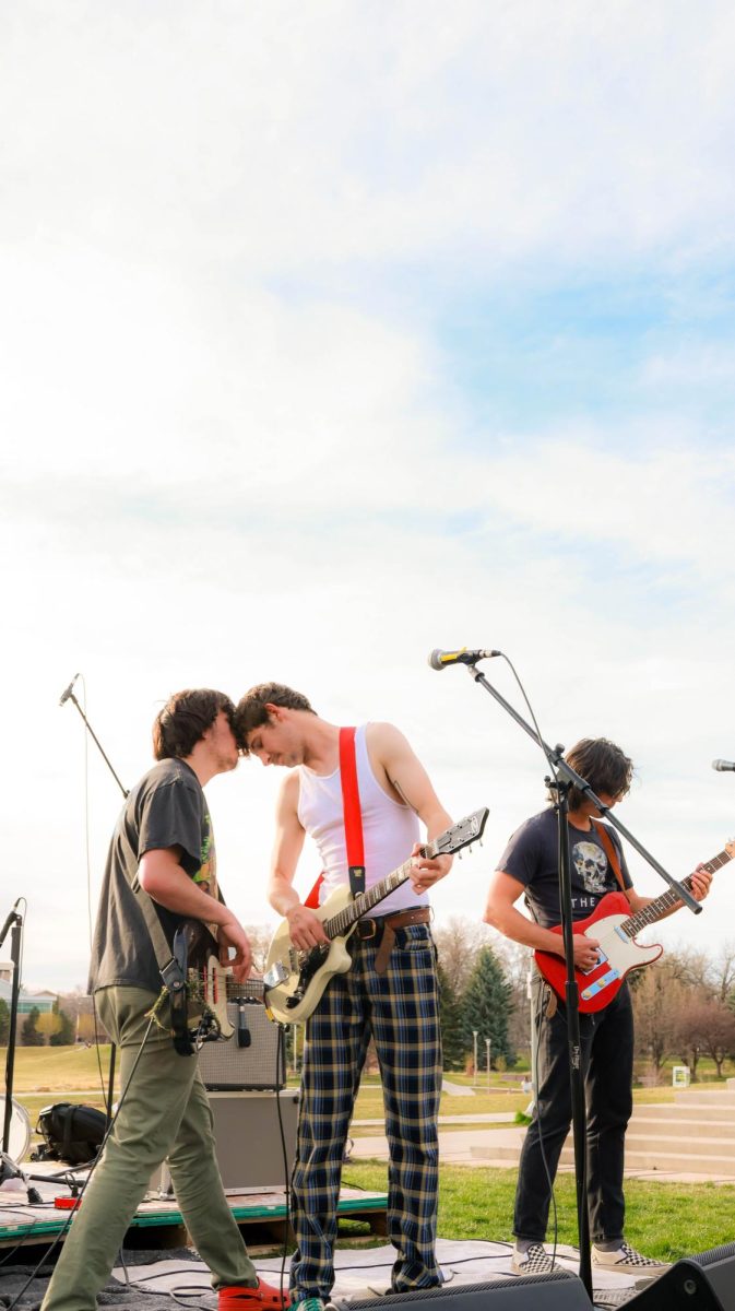 From left to right, Riley Merino, Ian Ehrhart and Colin Kelly give a performative jam at Fools Fest at Colorado State University April 4.