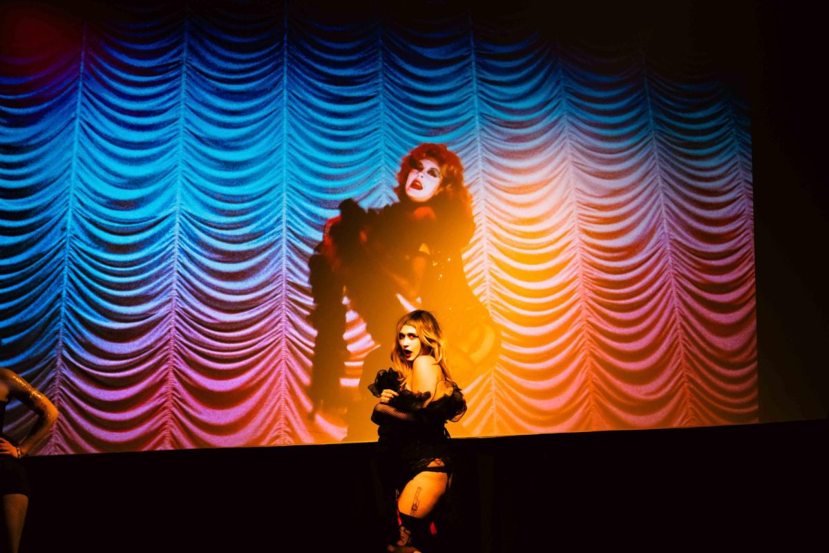 Janet, played by Devour Divinity, sings Rose Tint My World and dances in No Picnics performance of The Rocky Horror Picture Show at The Lyric April 12. 