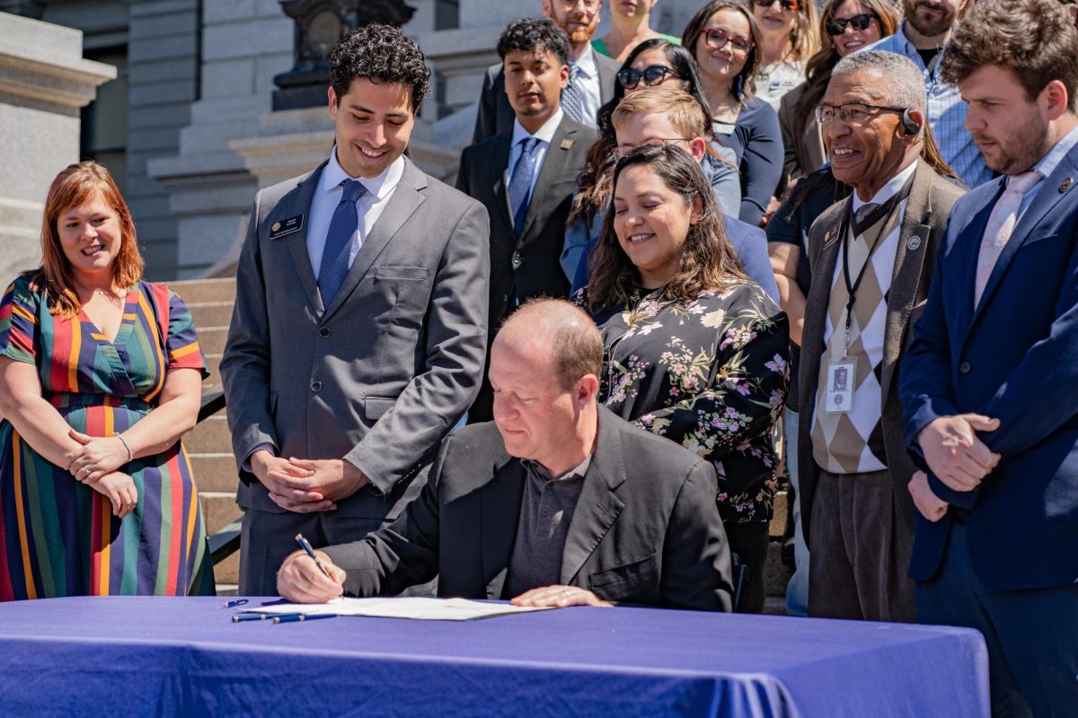 Gov.+Jared+Polis+signs+HB24-1007+on+the+west+steps+of+the+Colorado+state+Capitol+building+April+15.+The+opportunity+for+people+to+officially+be+on+the+lease+gives+them+protections%2C+Polis+said+during+the+signing+ceremony.