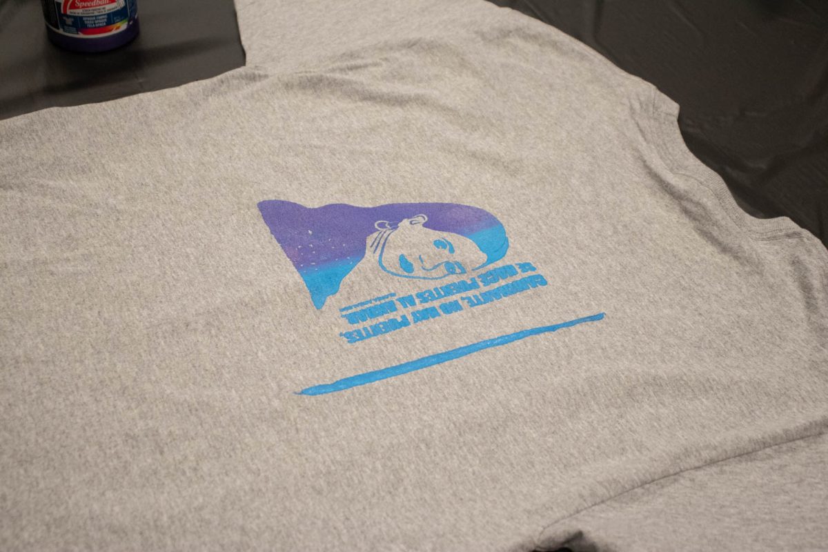 A completed t-shirt lays out to dry during the Love Women of Color: Celebrating Empowerment Through Art screen printing workshop April 18.