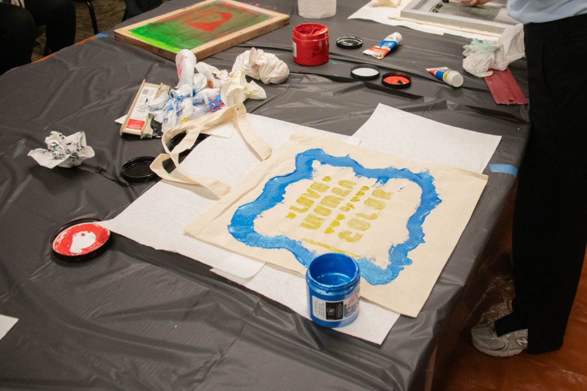A tote bag sits out to dry during the during the Love Women of Color: Celebrating Empowerment Through Art screen printing workshop April 18.