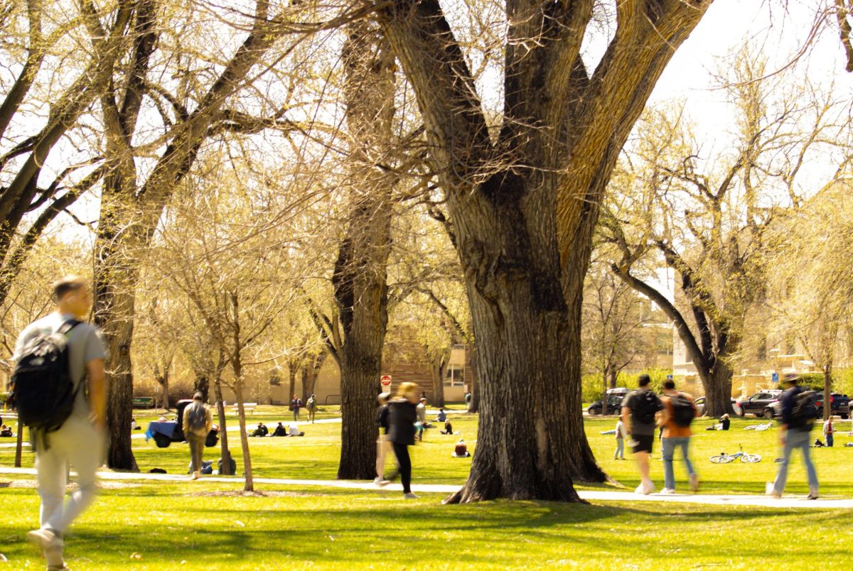 Students flock to The Oval to catch a glimpse of the partial solar eclipse April 8. "I hope the cute dogs at The Oval were able to watch the eclipse, too," student Andreas Broxson said.