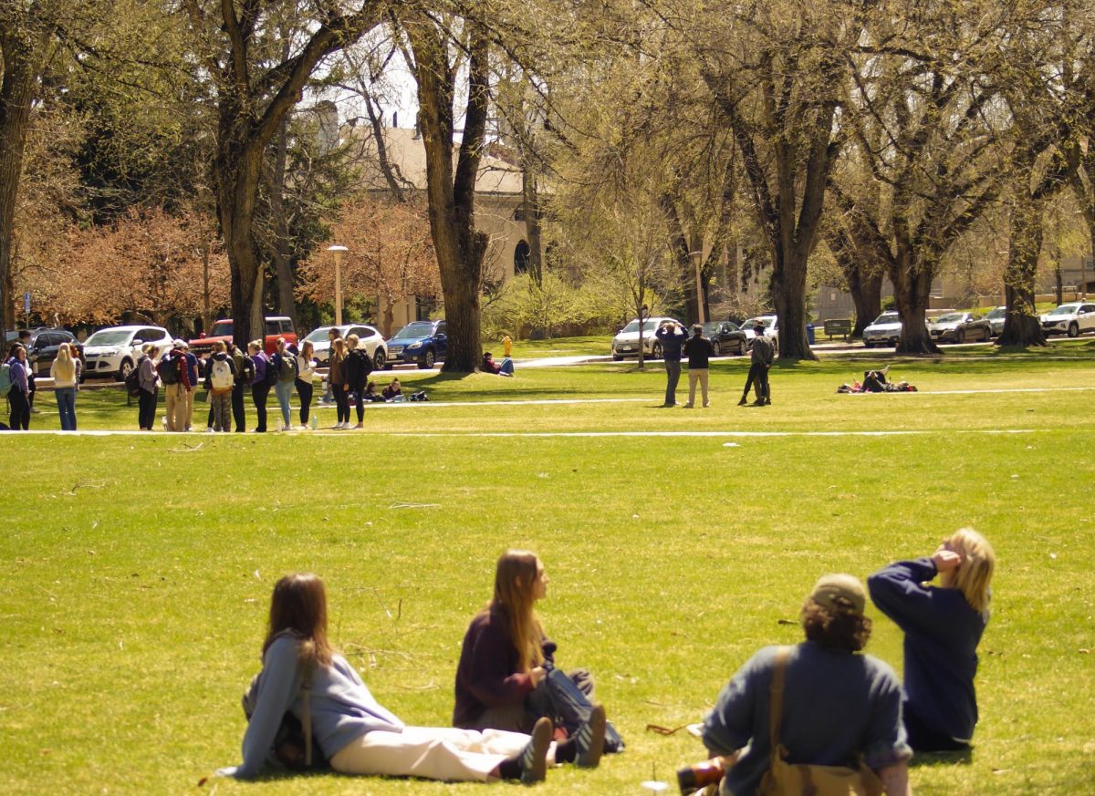 Students flock to the Oval to catch a glimpse of the partial solar eclipse on April 8, 2024. "I hope the cute dogs at the Oval were able to watch the eclipse too," said student Andreas Broxson. 