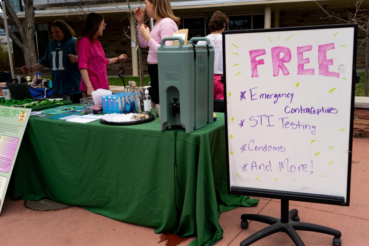 Members of the Associated Students of Colorado State University run a table on the Lory Student Center Plaza Wednesday, April 24 where they handed out free emergency contraceptives and other sexual healthcare items 